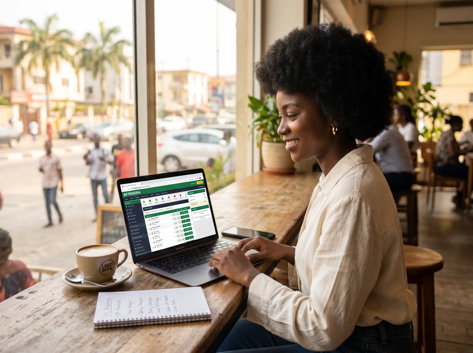 Nigerian editor researching odds at a Lagos cafe